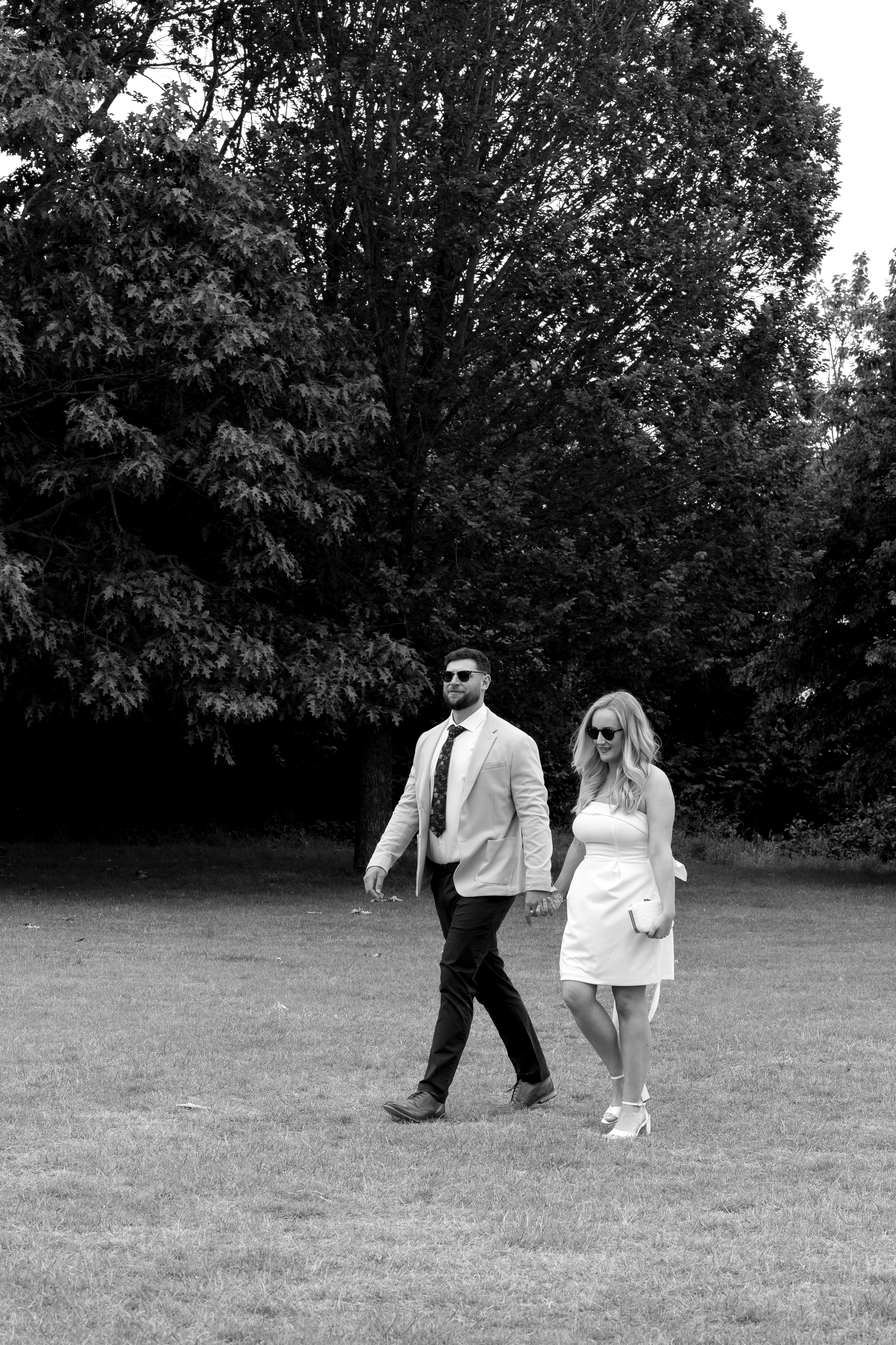 Couple walking through the grounds at Bellair House