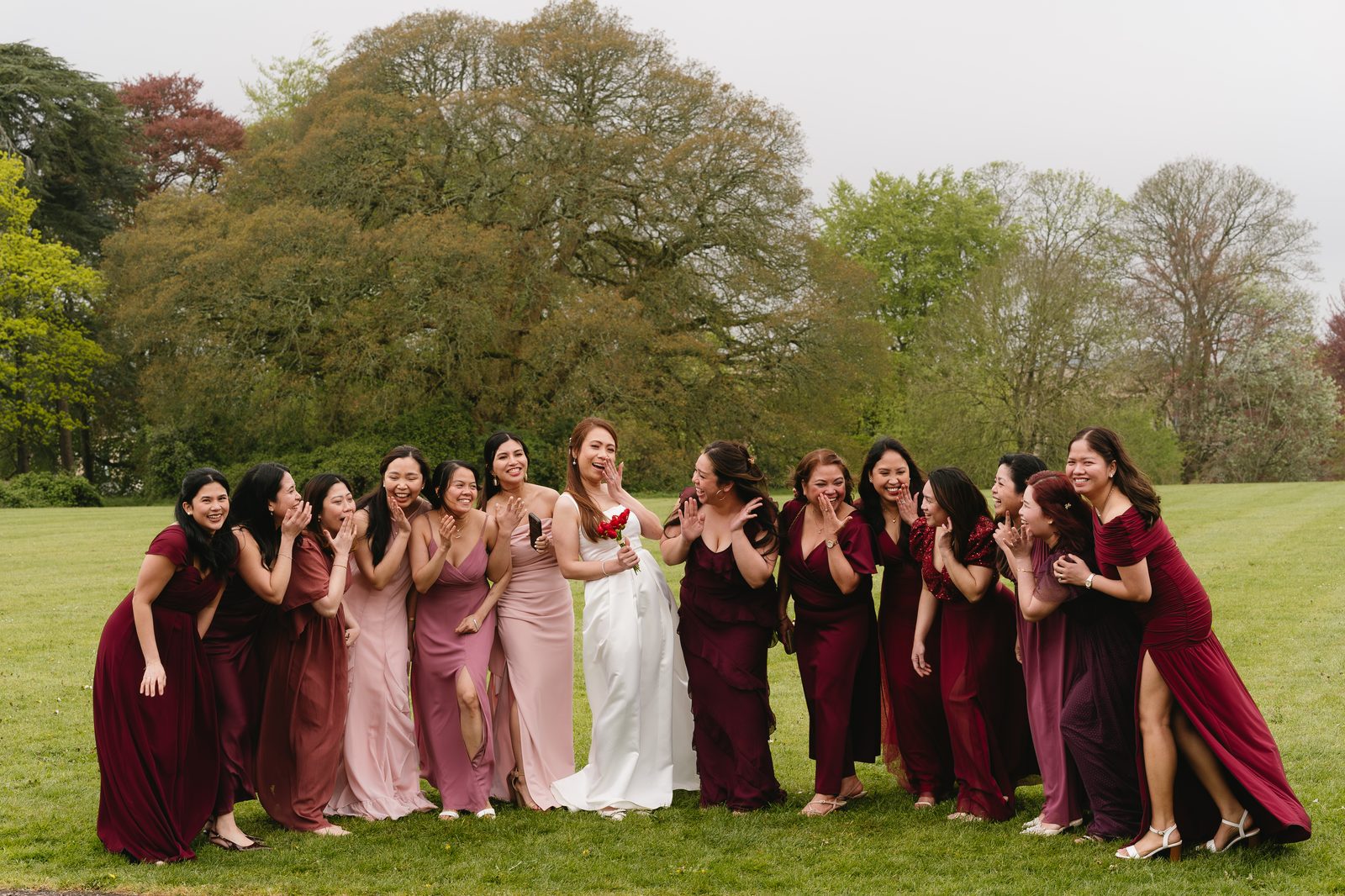 Bride with her bridesmaids laughing together
