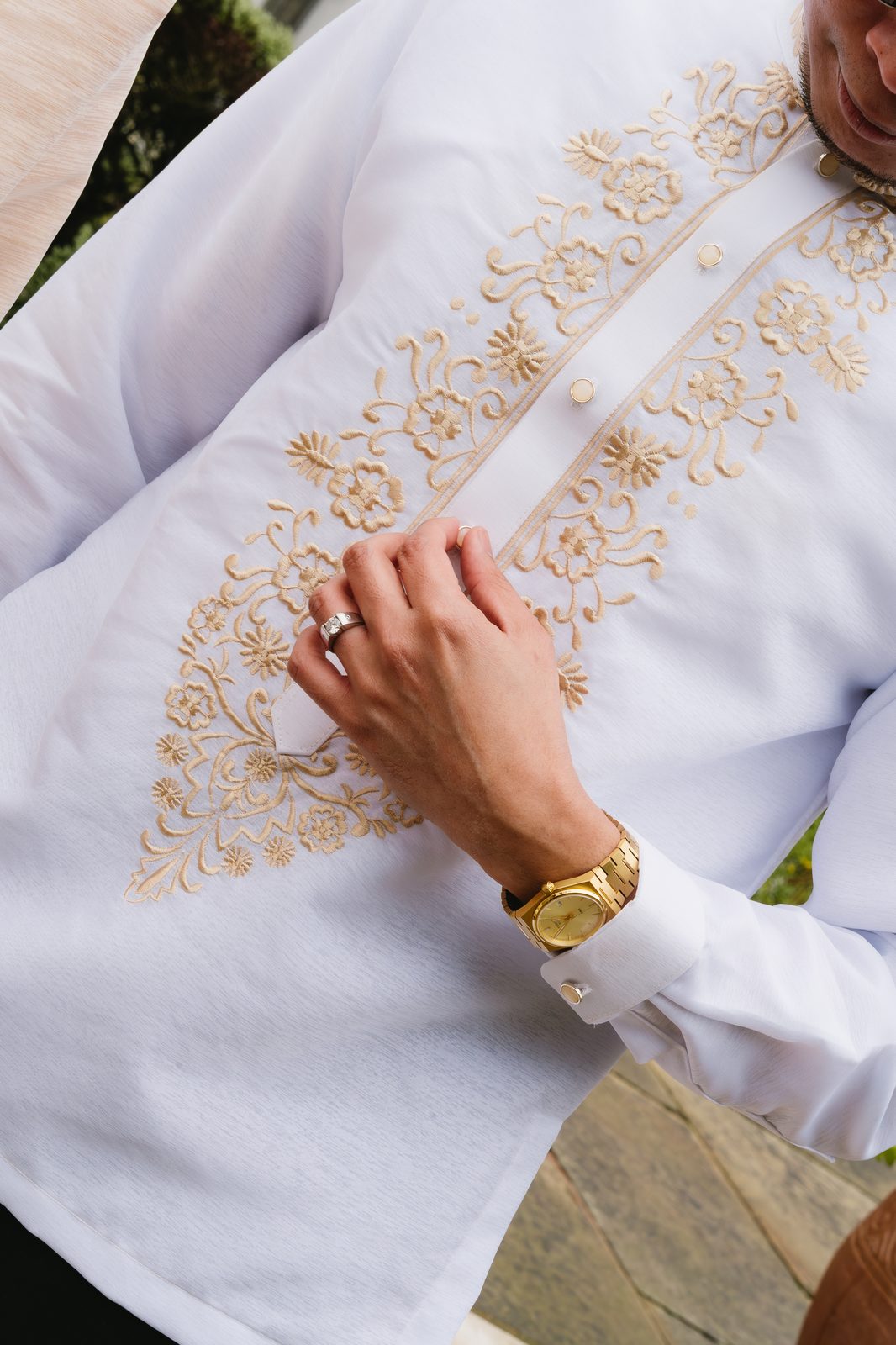 Embroidered wedding shirt and watch detail